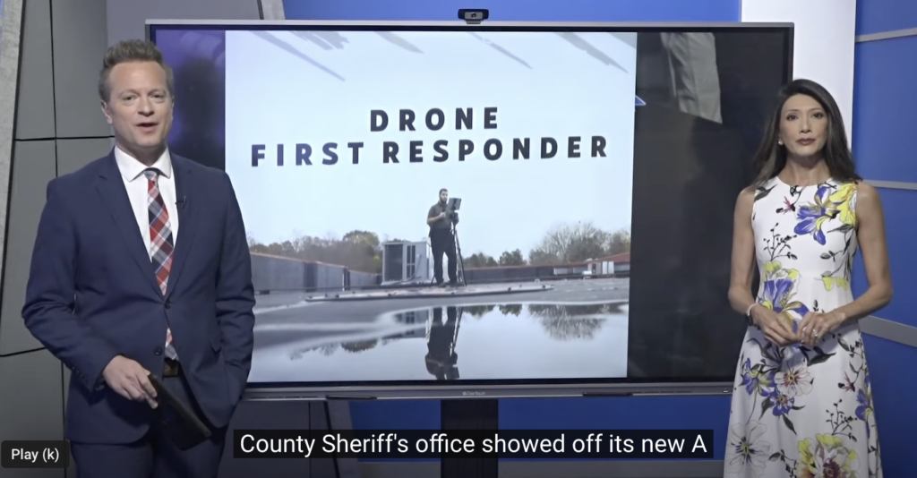 Screen cap of WFMY anchors sharing drone AED story.